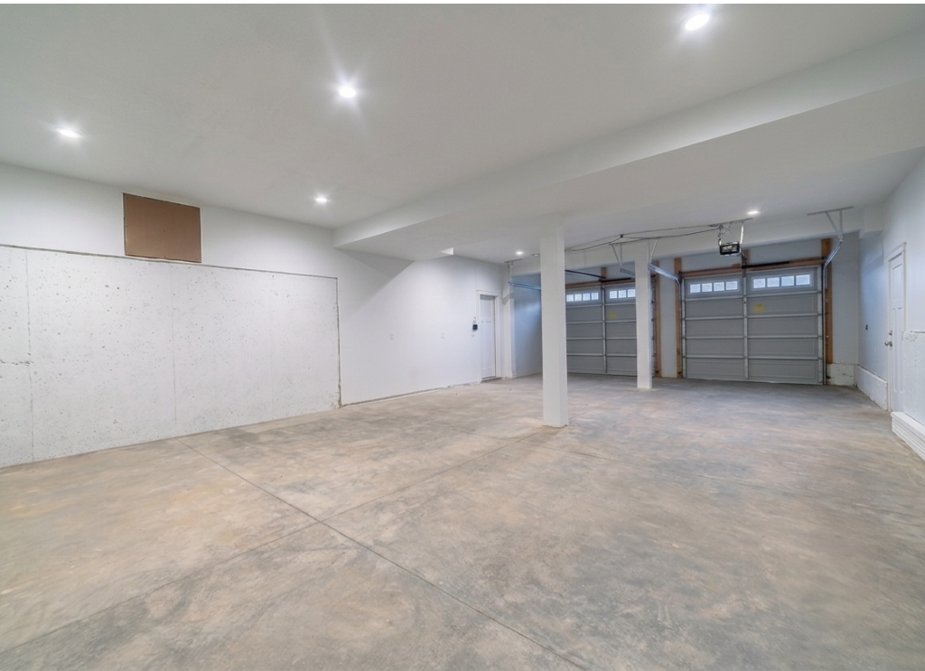 Smooth concrete garage floor inside a clean residential garage